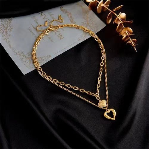 "Élan du Cœur – Collier Ailes d’Ange & Cœurs Entrelacés"
