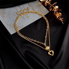"Élan du Cœur – Collier Ailes d’Ange & Cœurs Entrelacés"